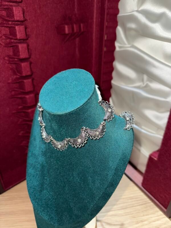 Half moon shaped silver choker necklace with earrings